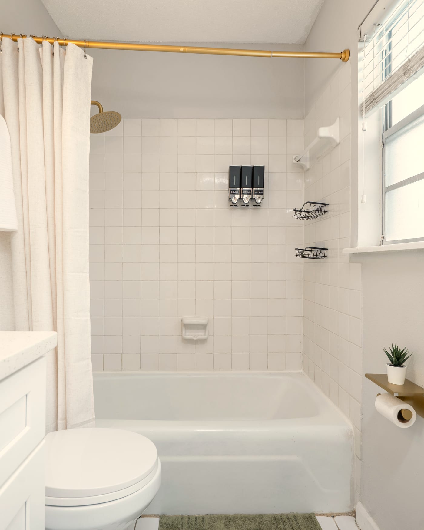 The full bathroom with tub and shower
